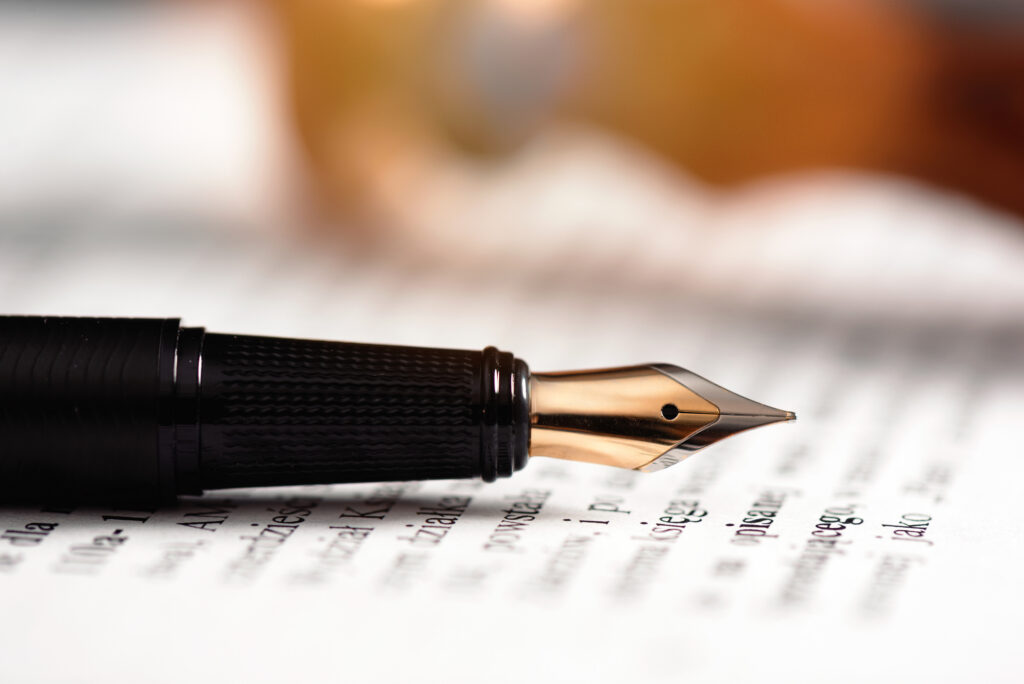 Fountain pen resting on a manuscript